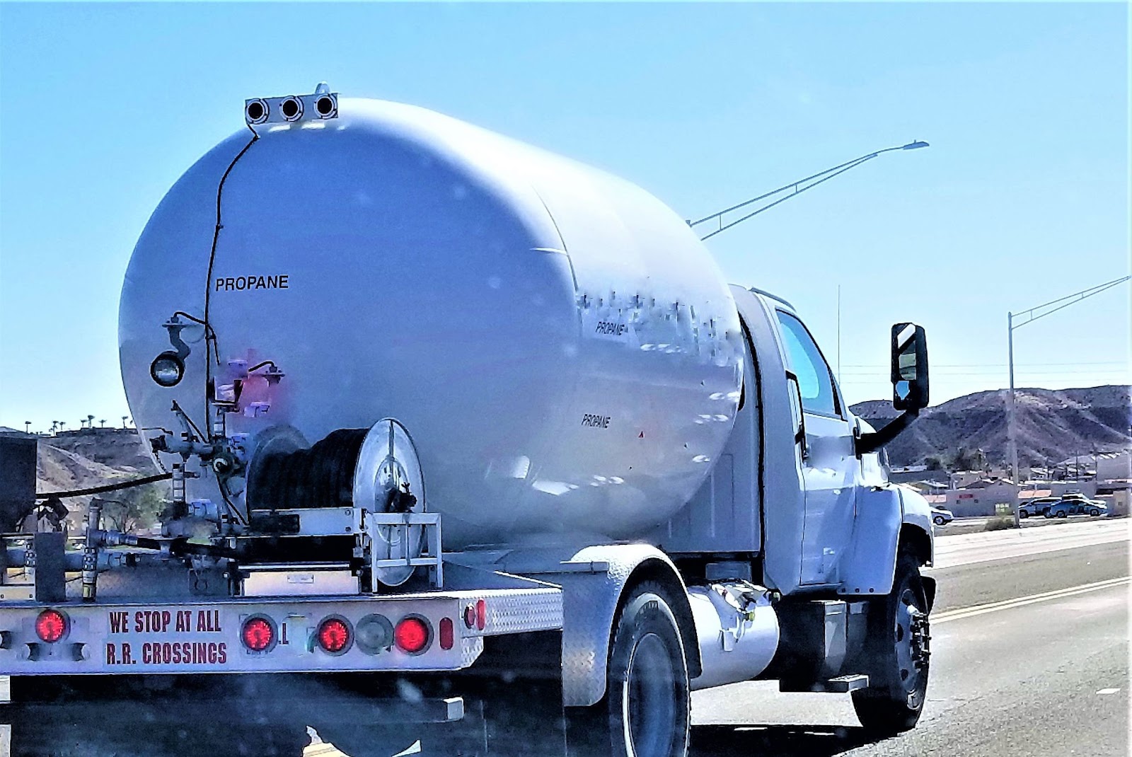 A propane tanker truck on the road, delivering fuel to ensure continuous energy supply for homes.